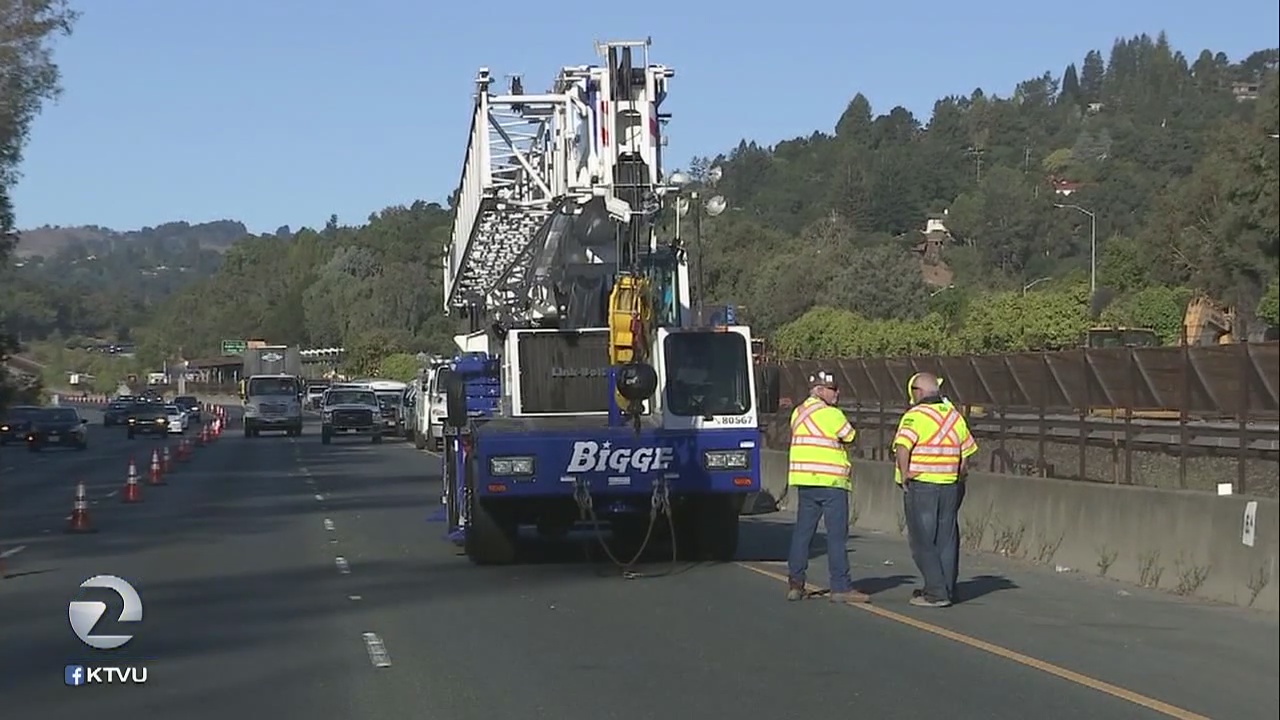 Crane crew takes down lines on Highway 24