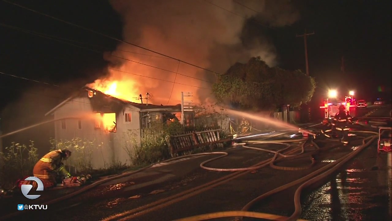 Suspect arrested after deputy's fiery crash into home