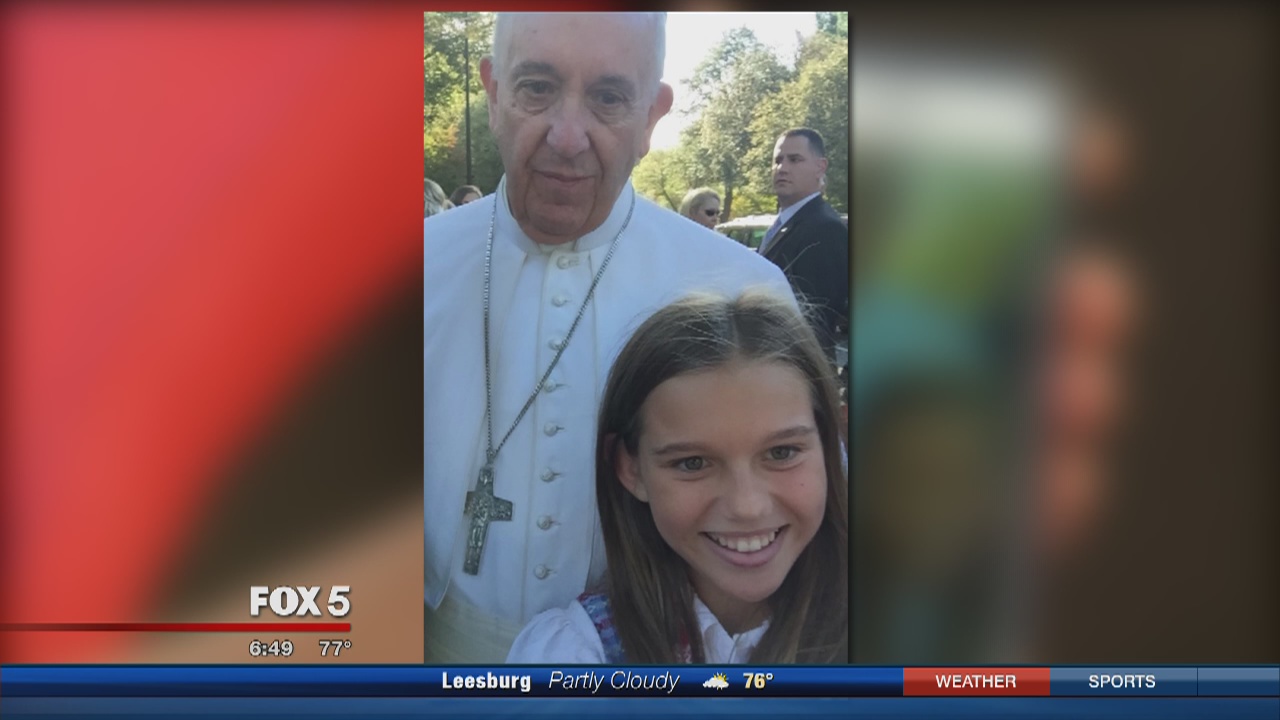 Group of kids take selfie with Pope Francis